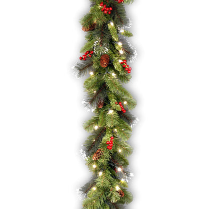 National Tree Company 9 ft Pre-Lit Crestwood Spruce Artificial Christmas Garland, Christmas Decoration with Glitter, Pinecones, Red Berries, 50 Warm White LED Lights, 180 Tips, Timer, Green