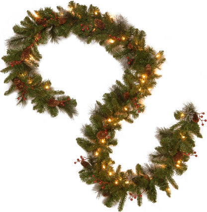National Tree Company 9 ft Pre-Lit Crestwood Spruce Artificial Christmas Garland, Christmas Decoration with Glitter, Pinecones, Red Berries, 50 Warm White LED Lights, 180 Tips, Timer, Green